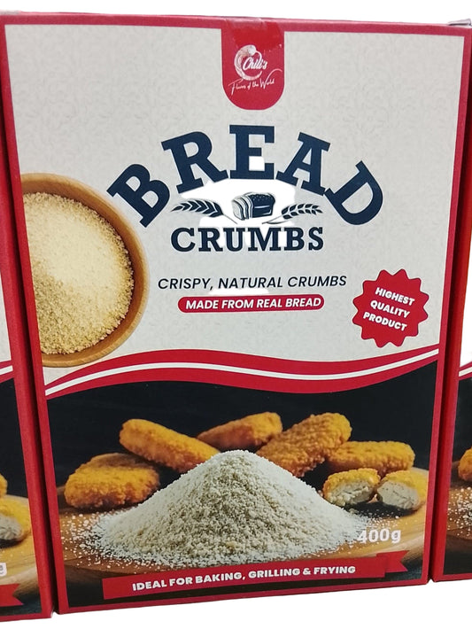 Box of bread crumbs with text and images on a wooden surface
